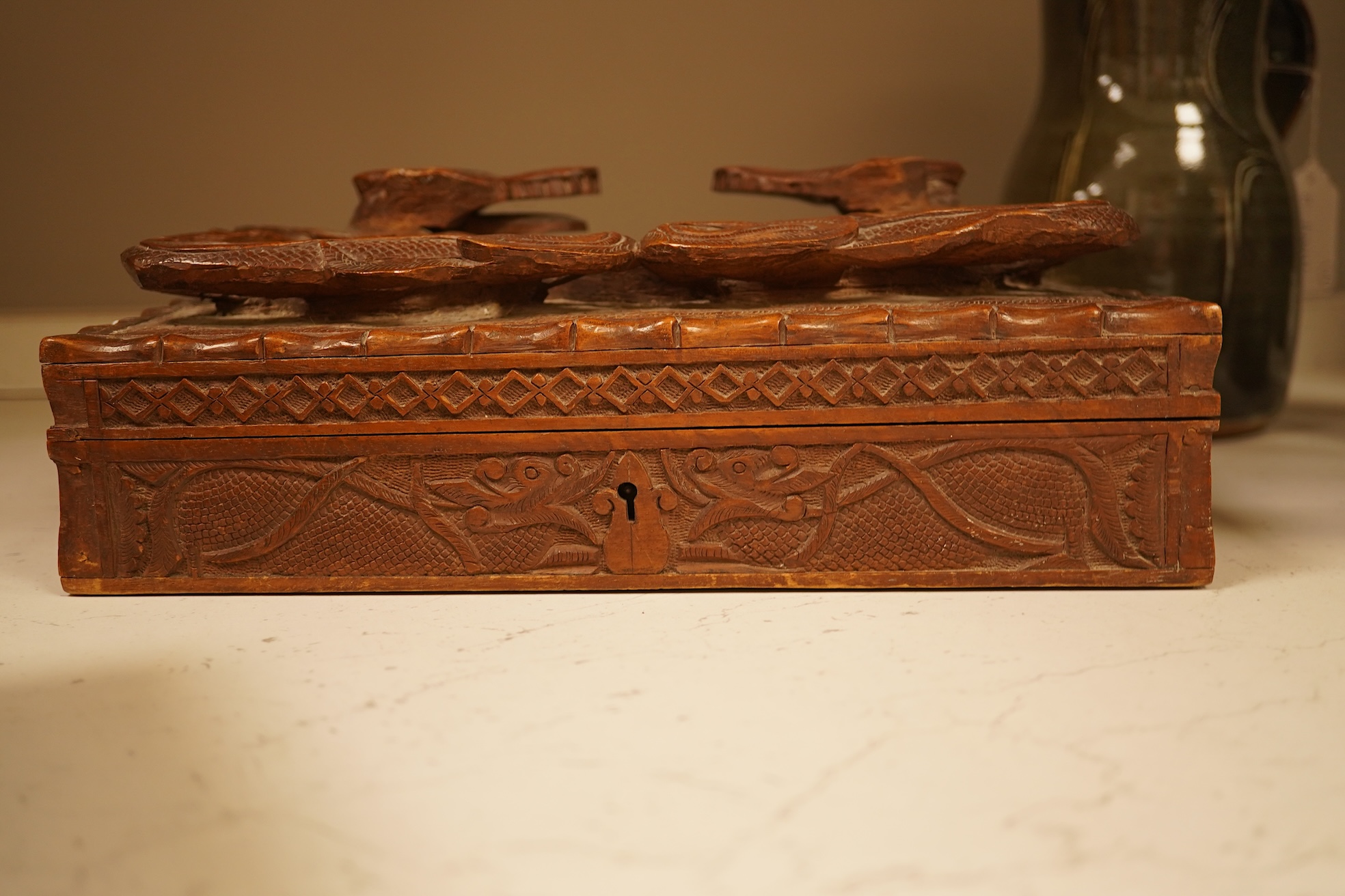 A late 19th century Japanese gilt metal lidded box together with a Burmese carved hardwood box, 28cm wide